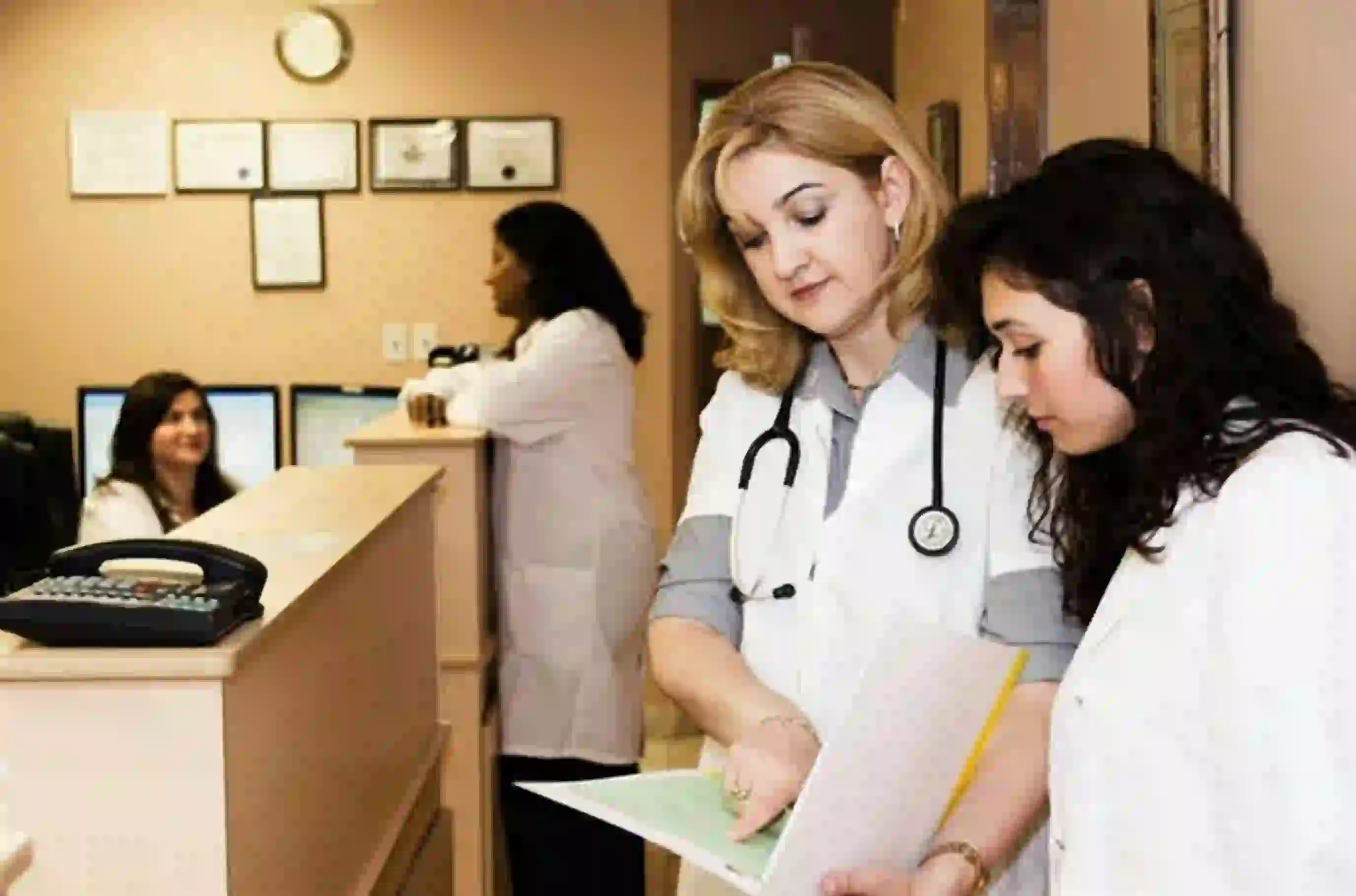Billing professional managing health insurance claim forms on a screen